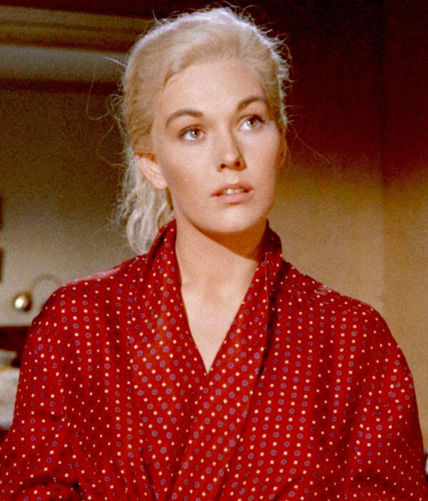 A picture of Kim Novak as she appears in the Alfred Hitchcock film Vertigo. She is wearing a red and white polka-dot housecoat.